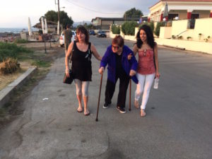 Yia Yia has difficulty walking even with two canes at Kalo Nero Beach.