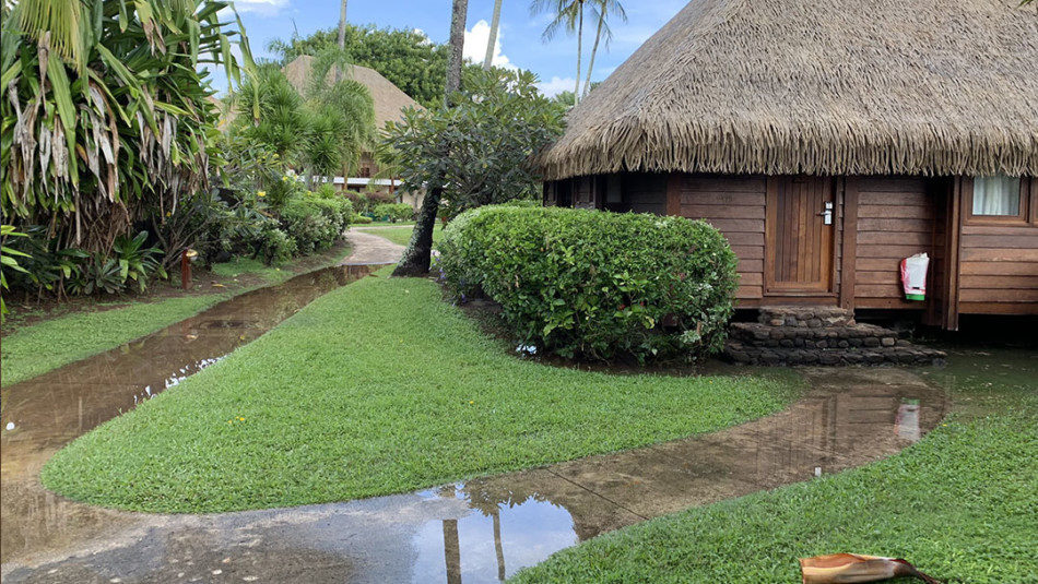 Waterclogged pathways at Manava Resort in Moorea after storm during shoulder season in April